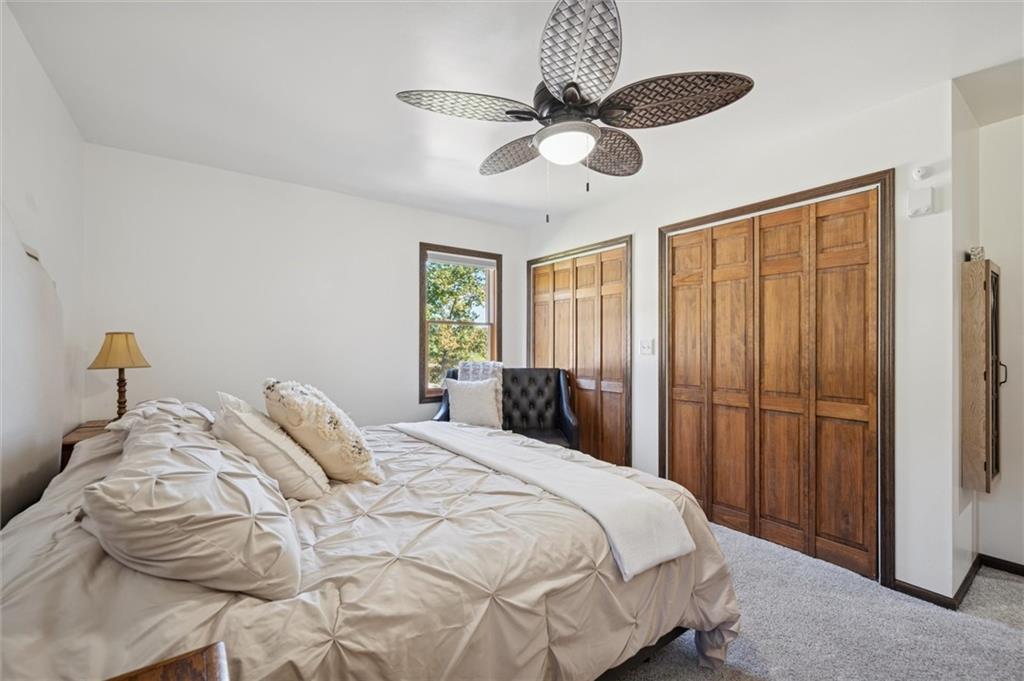 269 Boltz Road Cowansville, PA 16218 - Photo 20 of 38 a bedroom with a bed and a chandelier