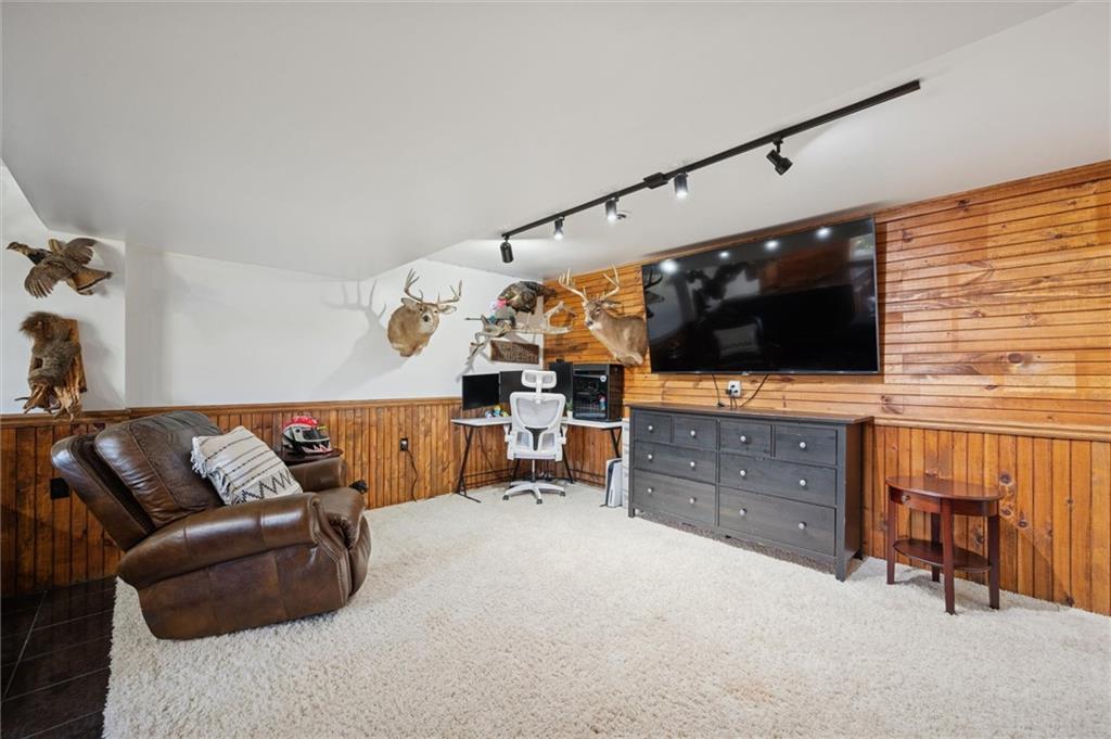 269 Boltz Road Cowansville, PA 16218 - Photo 26 of 38 a living room with furniture and a flat screen tv