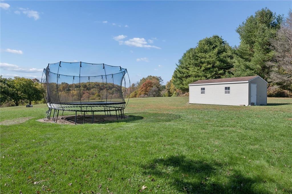 269 Boltz Road Cowansville, PA 16218 - Photo 33 of 38 a view of a house with a yard and a garage