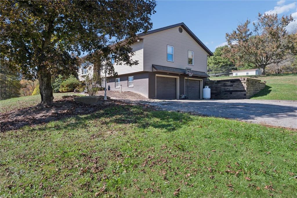 269 Boltz Road Cowansville, PA 16218 - Photo 4 of 38 a view of house with backyard and trees