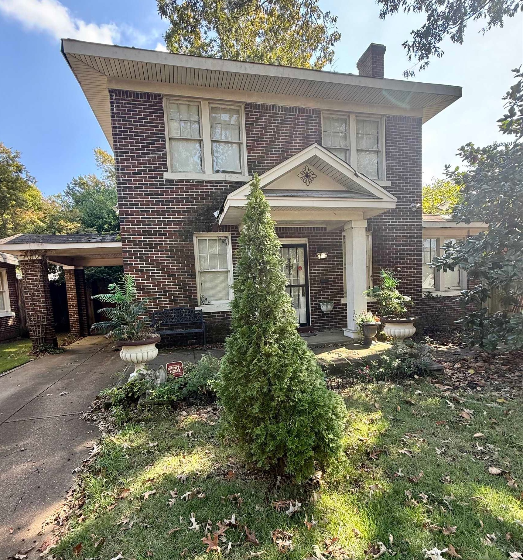 780 North Trezevant Street Memphis, TN 38112 - Photo 2 of 6 a front view of a house with garden