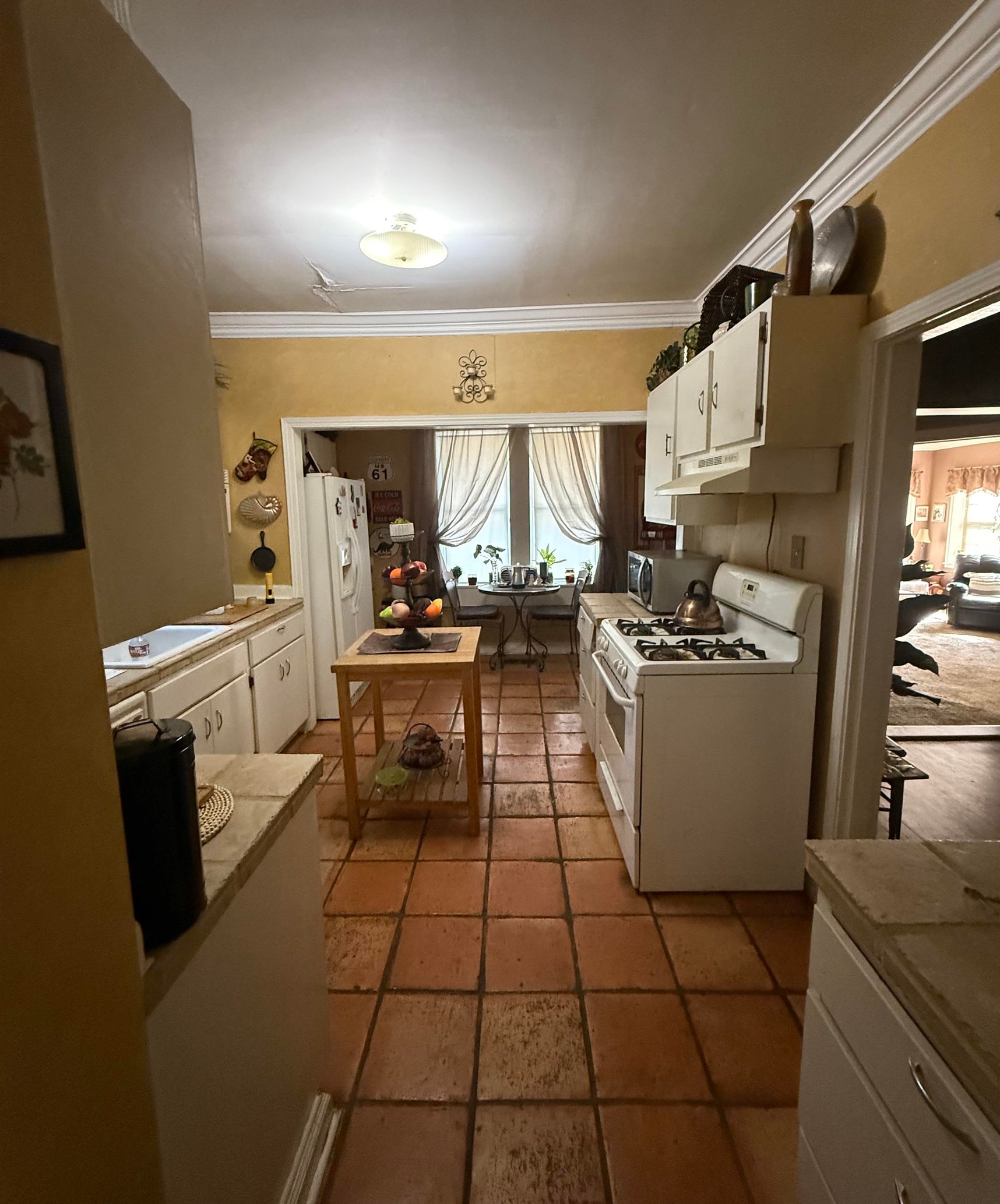 780 North Trezevant Street Memphis, TN 38112 - Photo 5 of 6 a kitchen with a sink appliances and cabinets