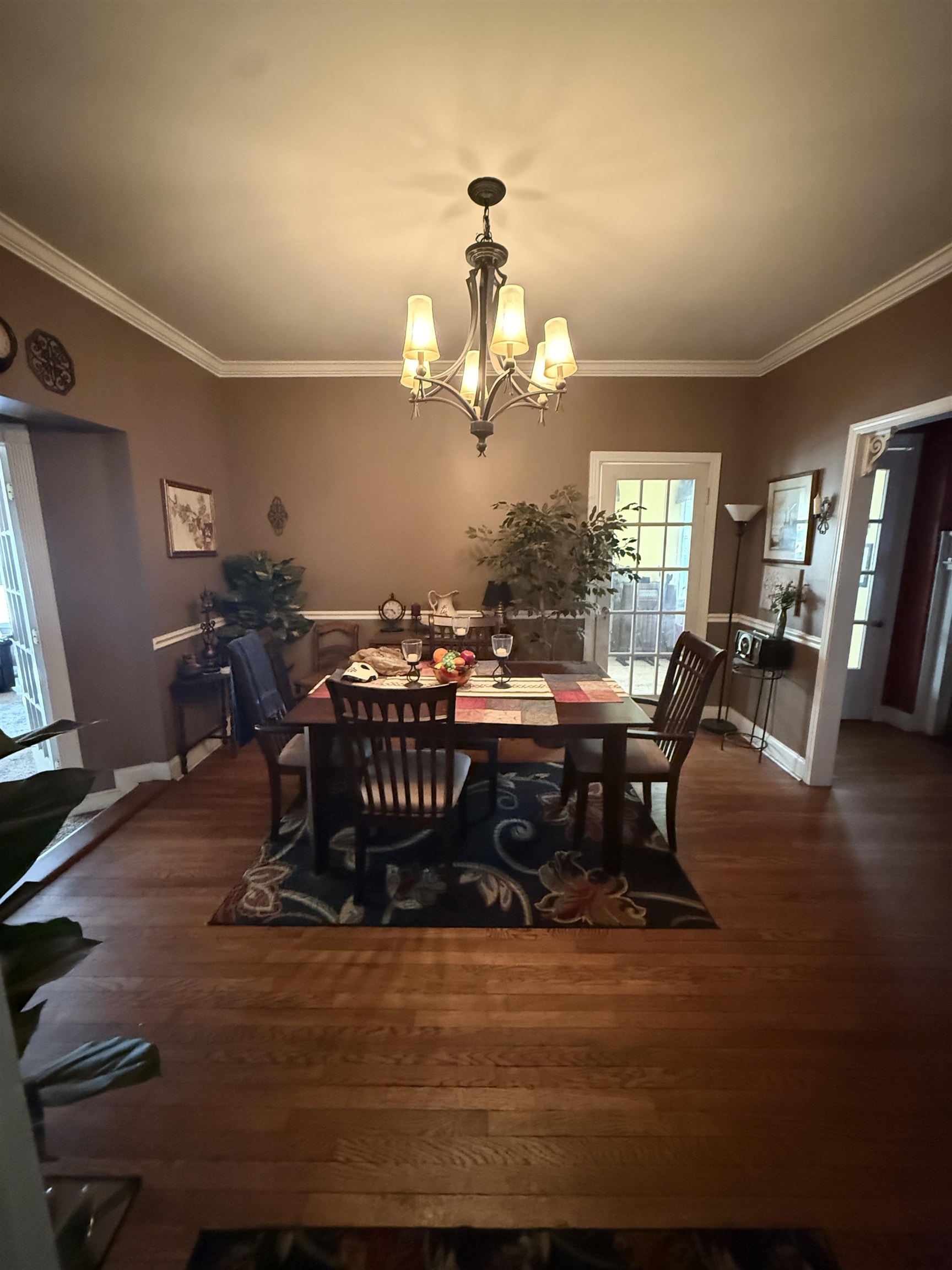 780 North Trezevant Street Memphis, TN 38112 - Photo 6 of 6 a living room with lots of furniture and chandelier