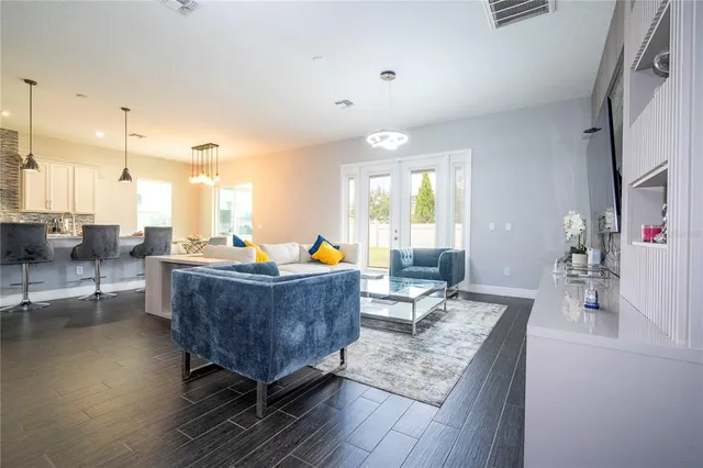 a bathroom with a bathtub shower sink mirror and toilet