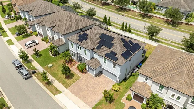 a swimming pool with outdoor seating and garden