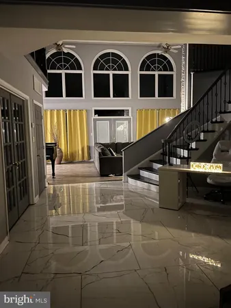 a view of entryway and kitchen