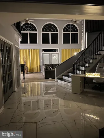 a view of entryway and kitchen