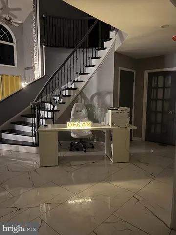 a large white open kitchen with a sink and dishwasher a stove top oven with wooden floor