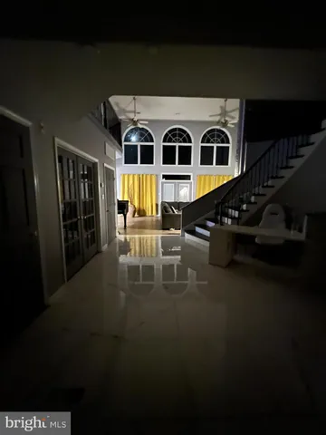 a view of a living room and balcony