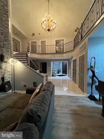 a lobby with furniture and a table