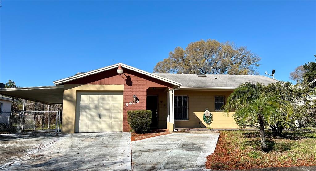 6404 Axelrod Road Tampa, FL 33634 - Photo 1 of 1 a front view of a house with a yard