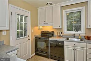 6001 Conway Road Bethesda, MD 20817 - Photo 11 of 21 KITCHEN WITH SIDE DOOR ENTRANCE
