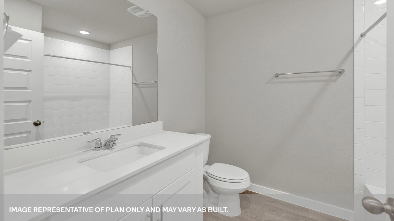198 Kolbo Crossing Lockhart, TX 78644 - Photo 6 of 23 a bathroom with a sink a toilet and shower