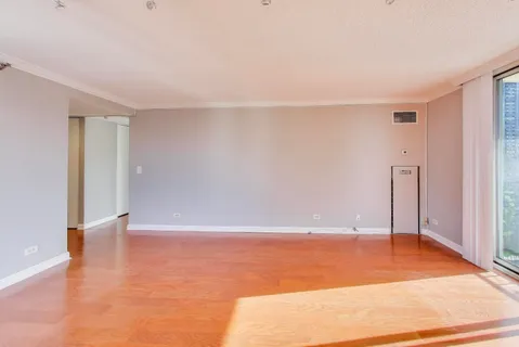 a kitchen with stainless steel appliances granite countertop a sink and a refrigerator