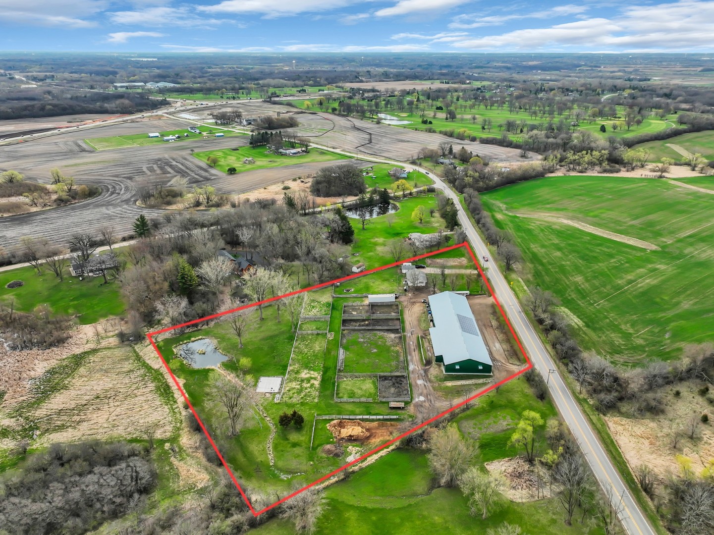 12216 Pleasant Valley Road Woodstock, IL 60098 - Photo 12 of 48 an aerial view of green landscape with outdoor space