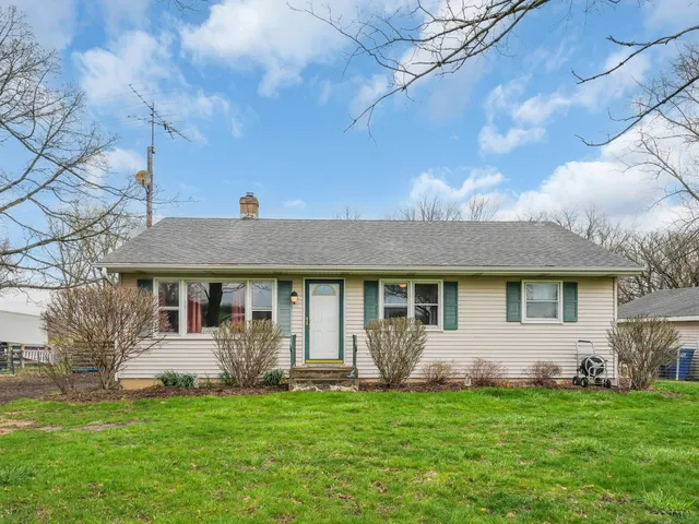 a view of a porch with wooden floor