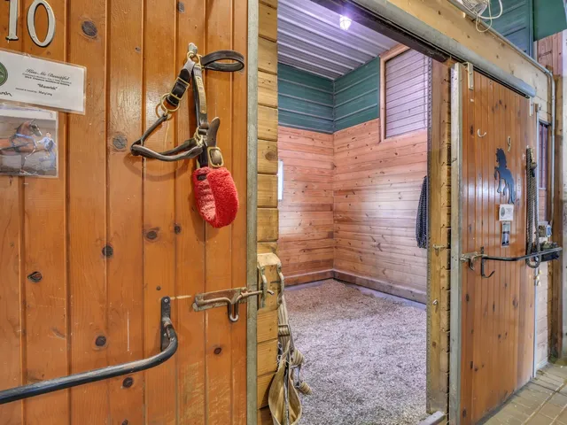 a bathroom with a toilet and a mirror