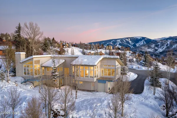 a view of a large building with a mountain