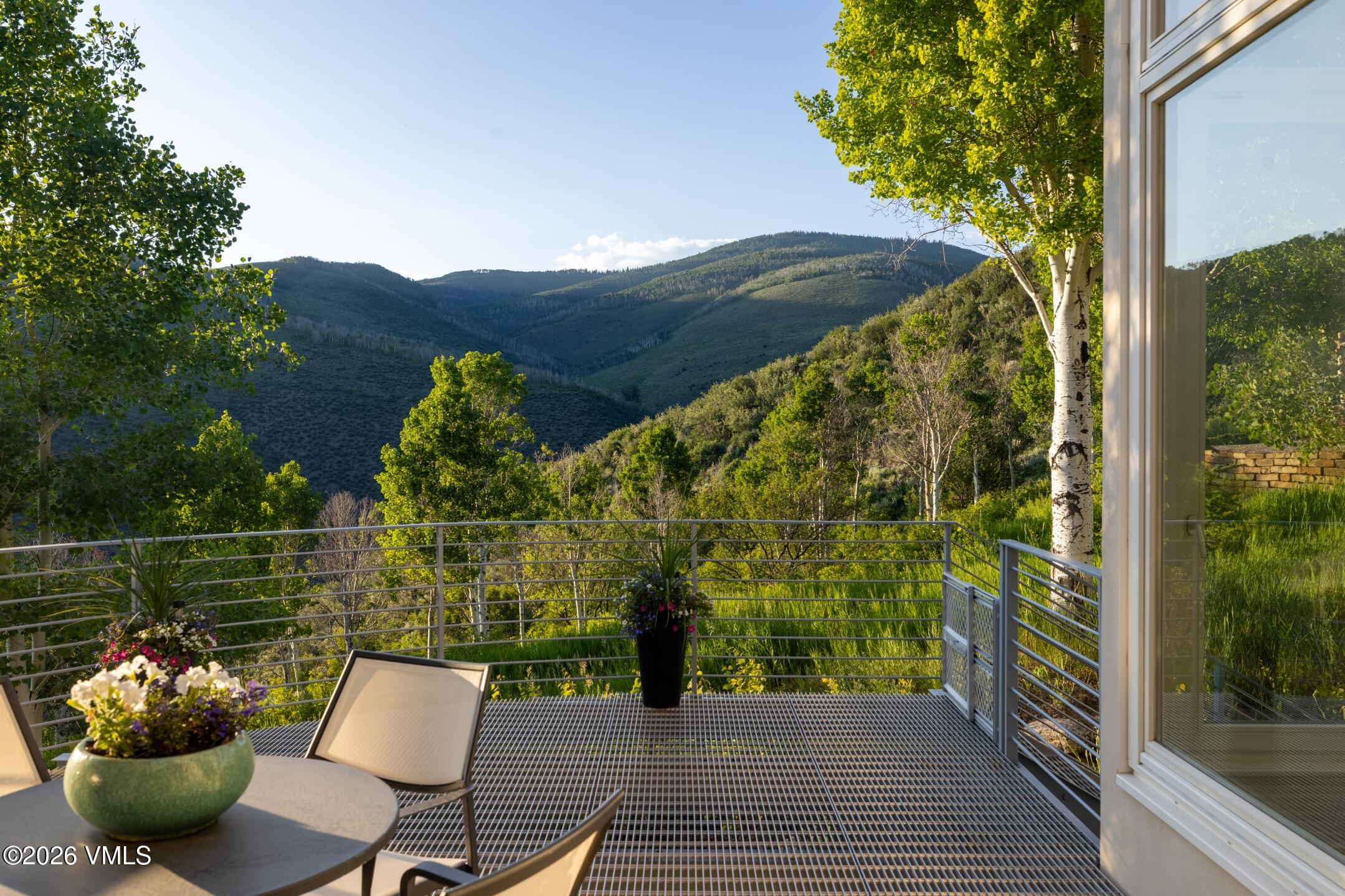 4340 June Point Avon, CO 81620 - Photo 13 of 43 a view of a balcony with chair table and chairs