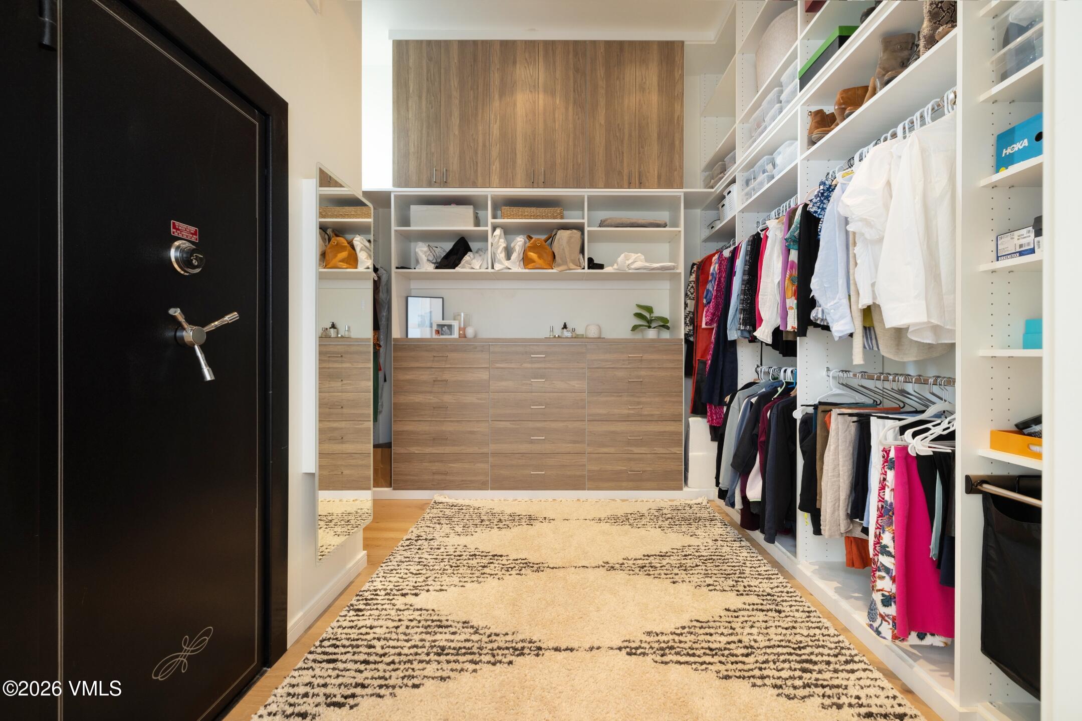4340 June Point Avon, CO 81620 - Photo 20 of 43 a view of walk in closet with clothes and shoes