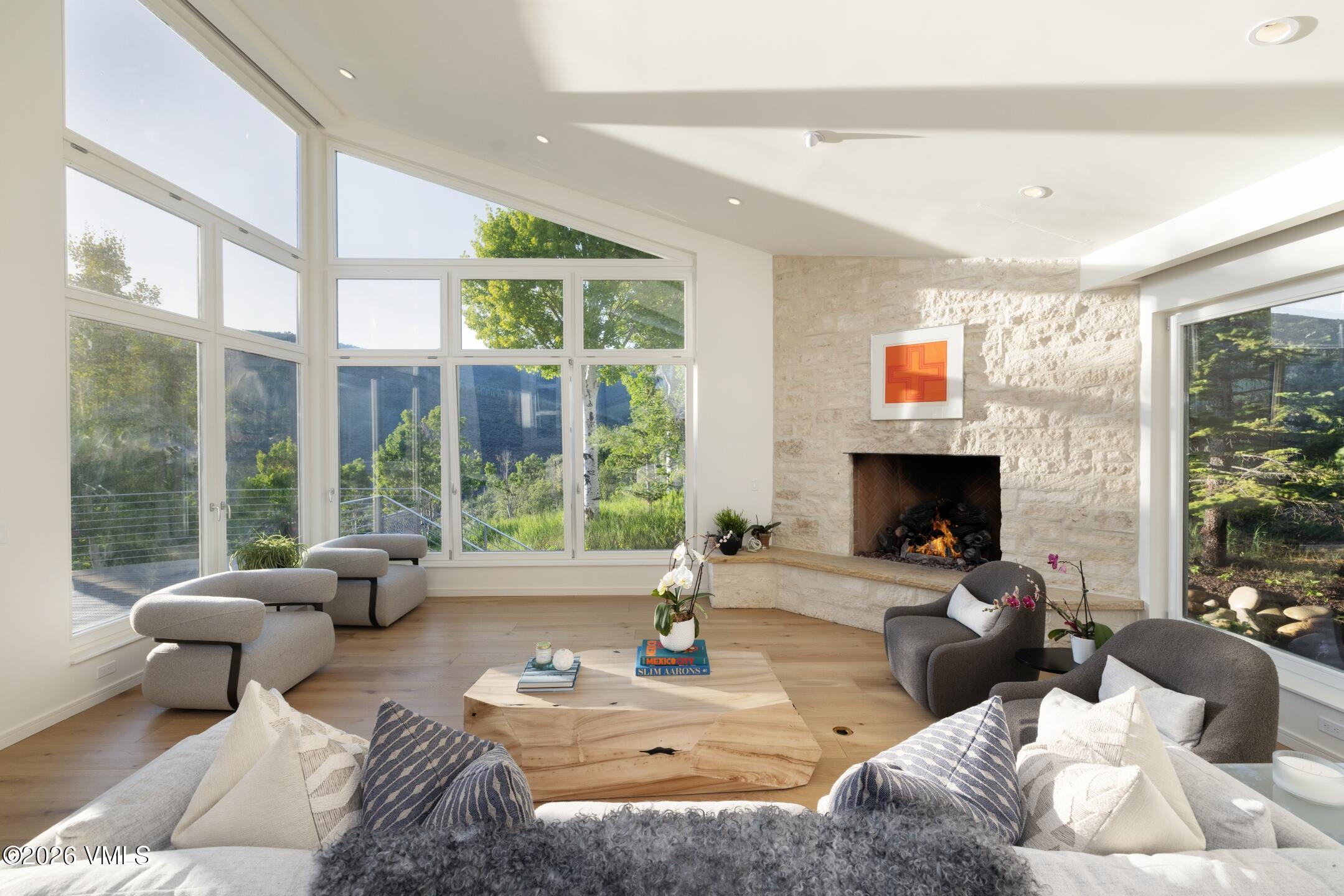 4340 June Point Avon, CO 81620 - Photo 2 of 43 a living room with furniture large window and a fireplace