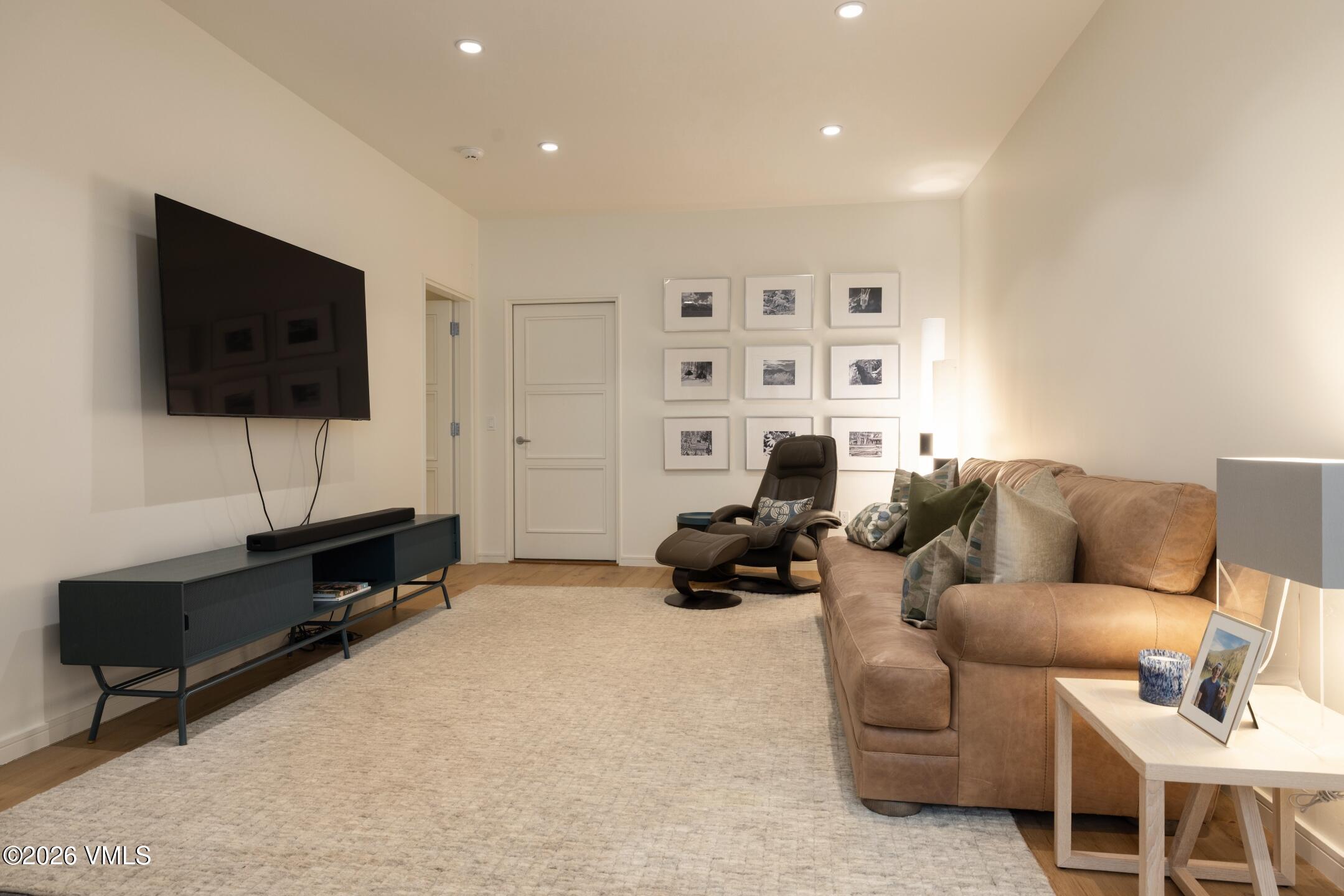4340 June Point Avon, CO 81620 - Photo 22 of 43 a living room with furniture and a flat screen tv