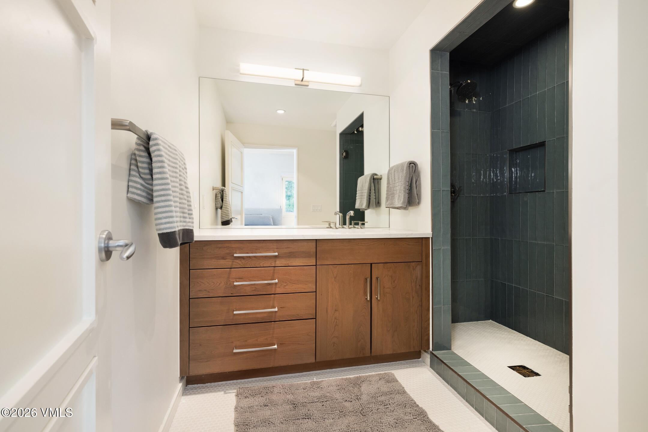 4340 June Point Avon, CO 81620 - Photo 27 of 43 a bathroom with a sink a toilet and shower