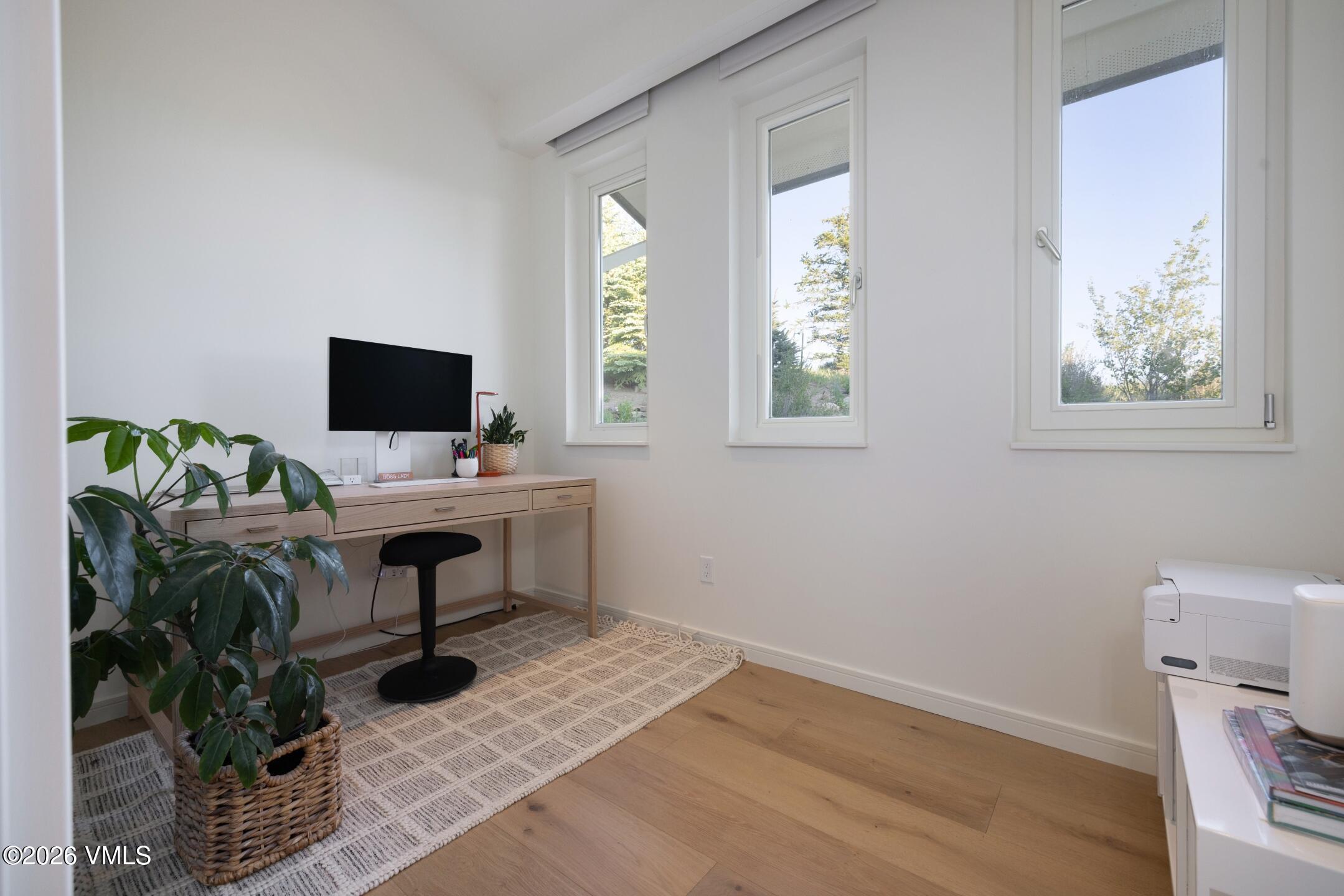 4340 June Point Avon, CO 81620 - Photo 29 of 43 a view of a workspace with furniture and a window