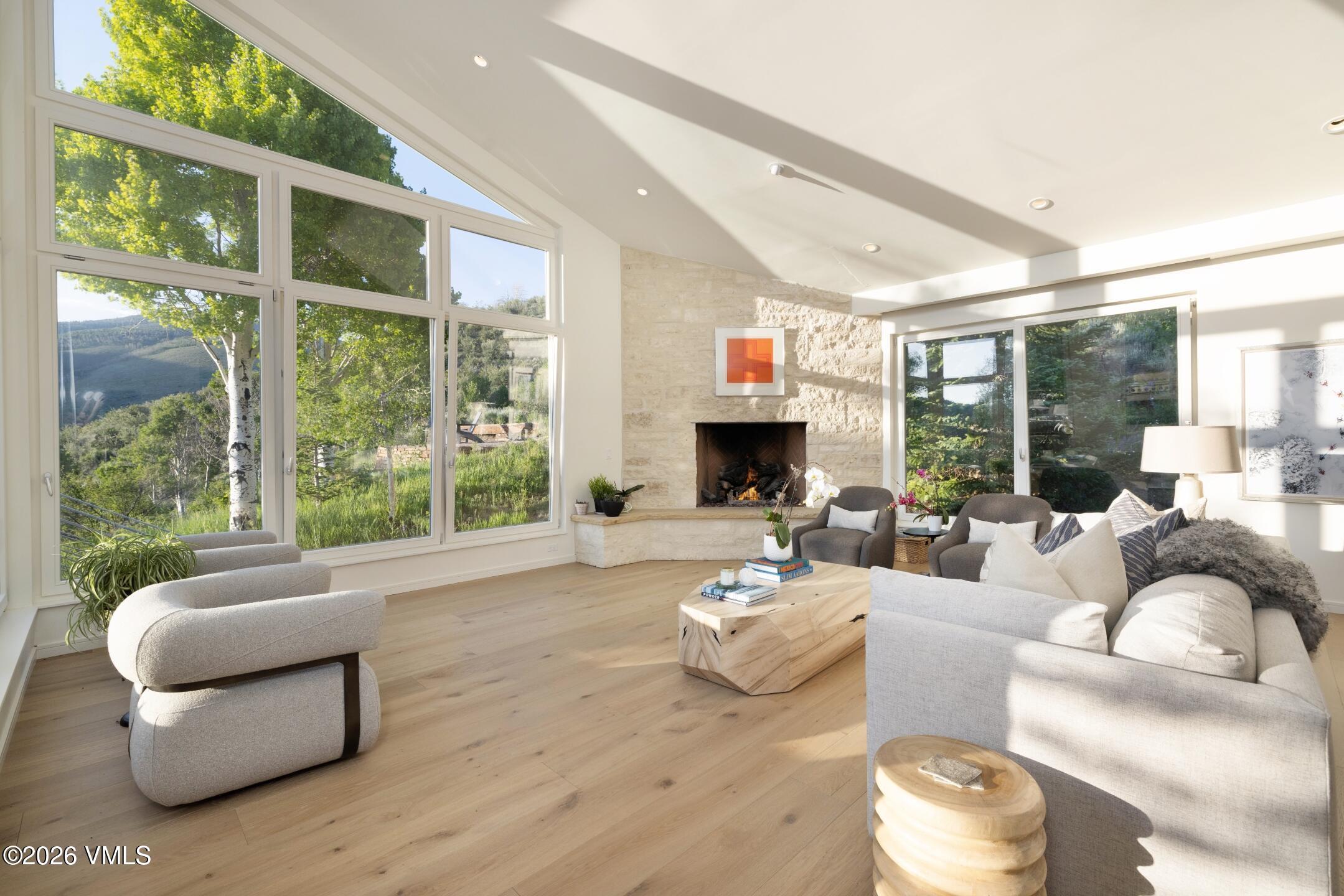 4340 June Point Avon, CO 81620 - Photo 3 of 43 a living room with furniture fireplace and a large window