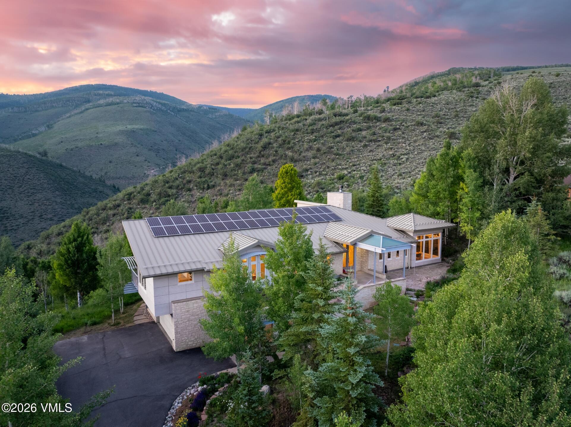 4340 June Point Avon, CO 81620 - Photo 38 of 43 an aerial view of a house with a garden