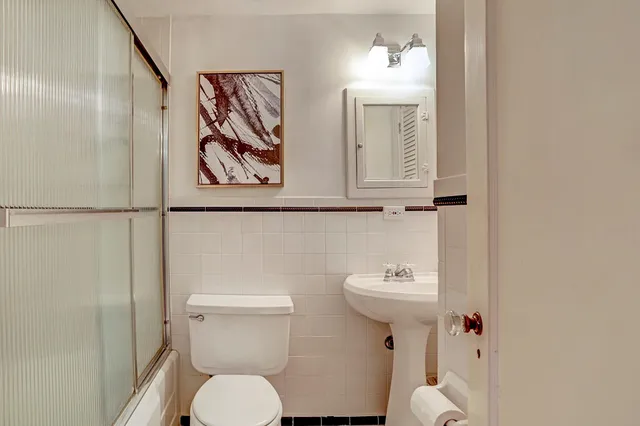 a kitchen with a refrigerator and a stove