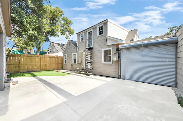 a bedroom with bed and a book shelf