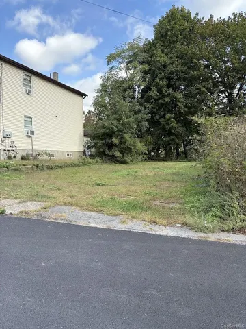 a view of a big yard with an outdoor space