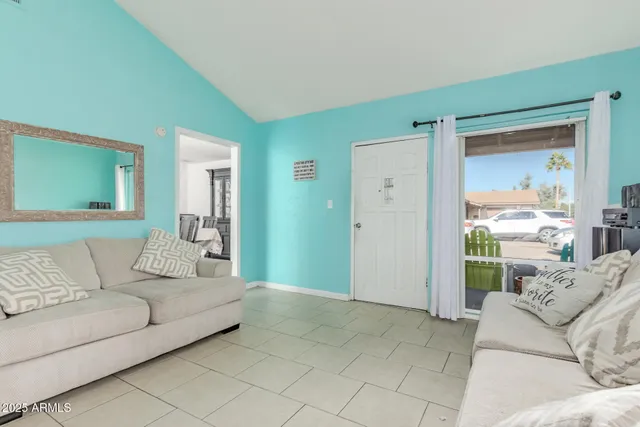 a living room with furniture and a large window