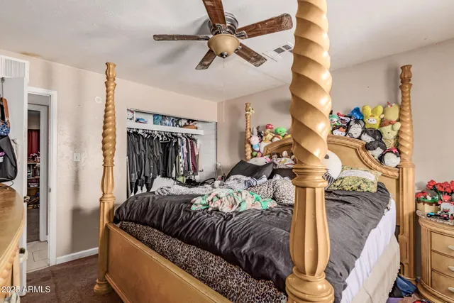 a bedroom with furniture and a window