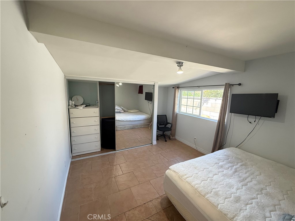 1014 North Daisy Avenue Santa Ana, CA 92703 - Photo 11 of 27 a kitchen with a refrigerator and window