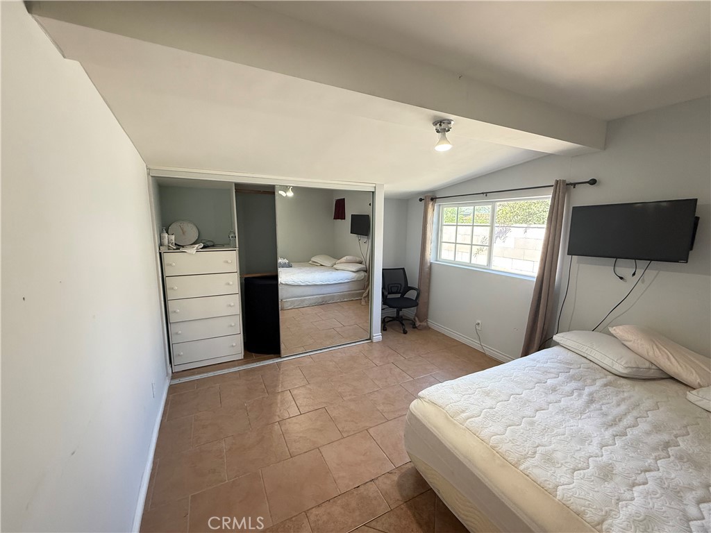 1014 North Daisy Avenue Santa Ana, CA 92703 - Photo 12 of 27 a bedroom with a bed and window