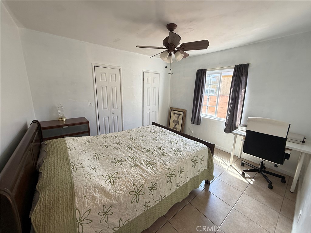1014 North Daisy Avenue Santa Ana, CA 92703 - Photo 18 of 27 a bedroom with a bed and a flat screen tv