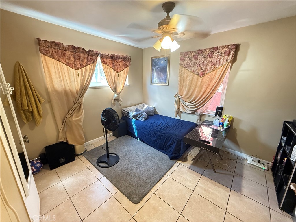 1014 North Daisy Avenue Santa Ana, CA 92703 - Photo 20 of 27 a living room with a couch and a chandelier