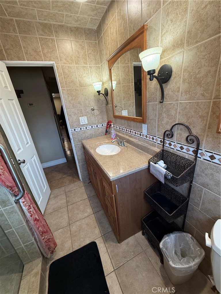 1014 North Daisy Avenue Santa Ana, CA 92703 - Photo 21 of 27 a bathroom with a sink mirror vanity and toilet