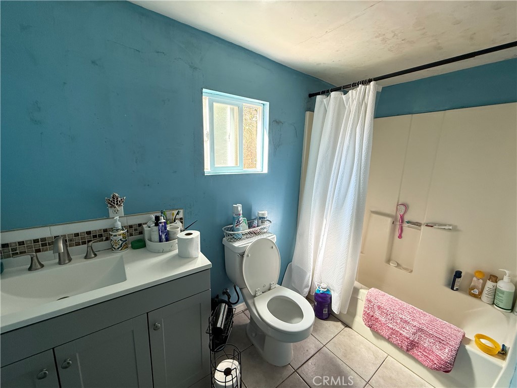 1014 North Daisy Avenue Santa Ana, CA 92703 - Photo 27 of 27 a bathroom with a sink toilet and shower
