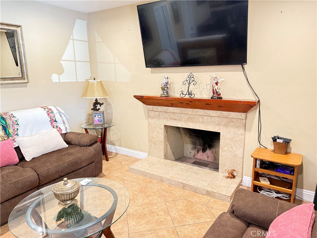 1014 North Daisy Avenue Santa Ana, CA 92703 - Photo 8 of 27 a living room with furniture and a fireplace