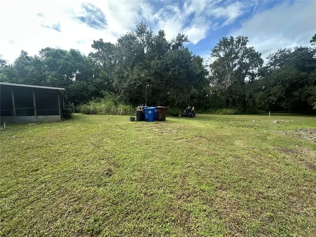 a view of a backyard with a trees