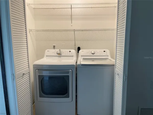 a utility room with dryer and washer