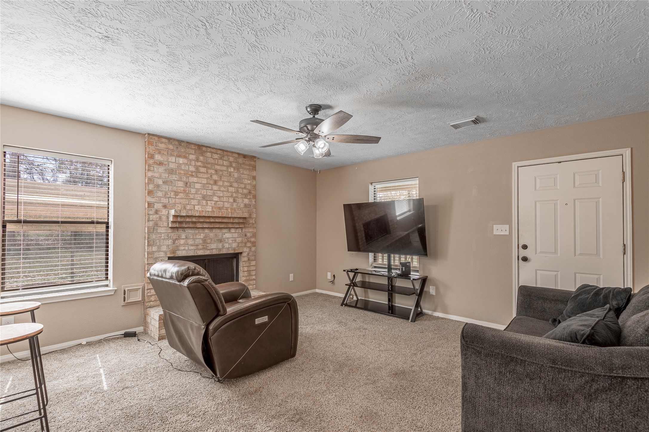 2 Brown Road Huntsville, TX 77320 - Photo 11 of 28 a living room with furniture and a flat screen tv