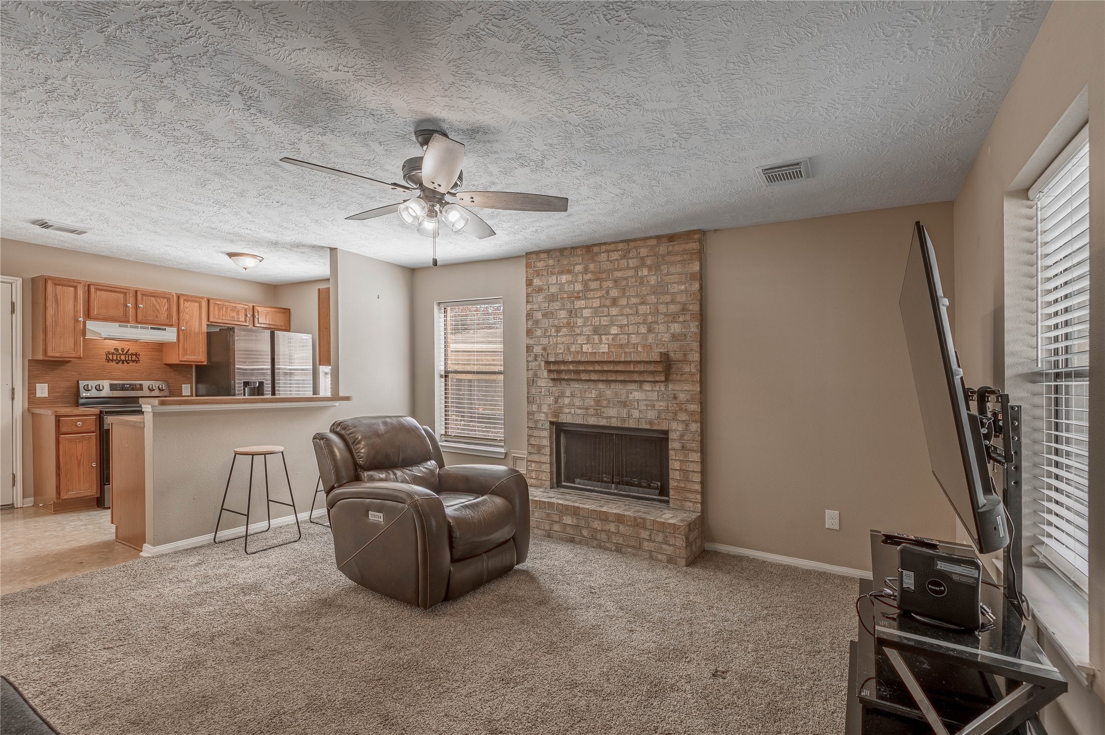 2 Brown Road Huntsville, TX 77320 - Photo 12 of 28 a living room with furniture and a fireplace