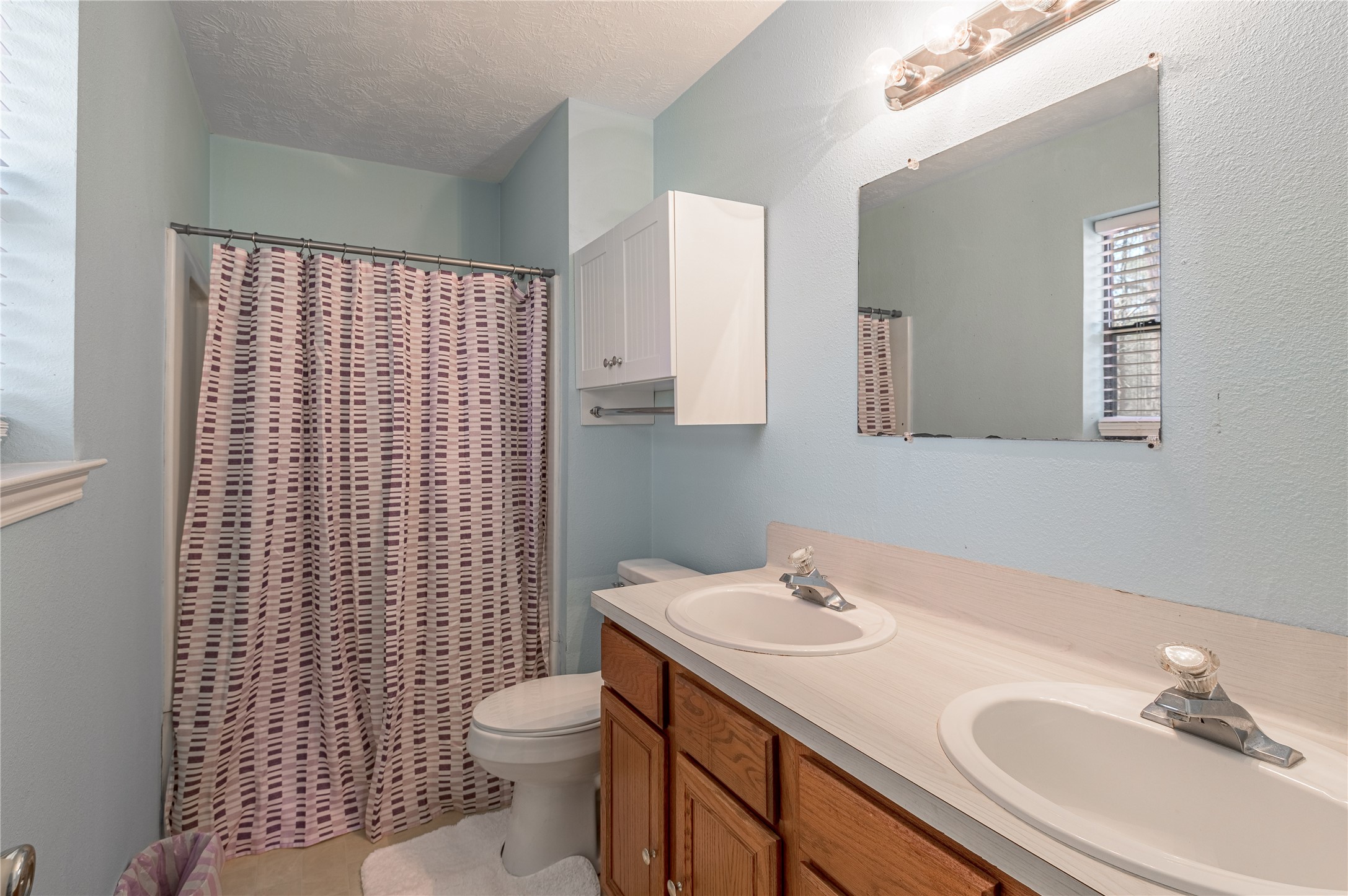 2 Brown Road Huntsville, TX 77320 - Photo 16 of 28 a bathroom with a sink toilet and shower