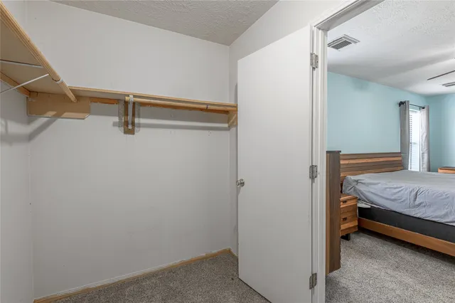 a bedroom with a bed and a table