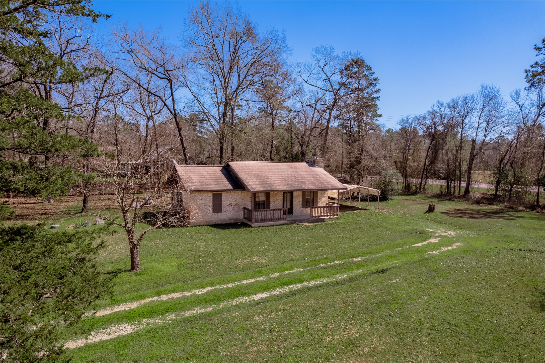 2 Brown Road Huntsville, TX 77320 - Photo 22 of 28 a view of a garden with a slide