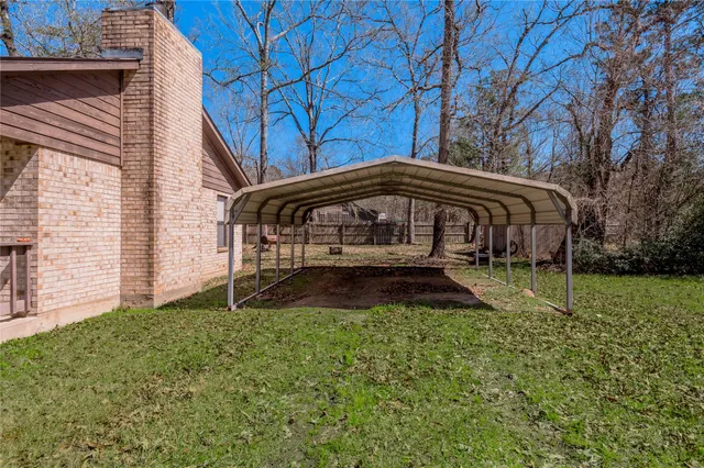 a view of house with a yard